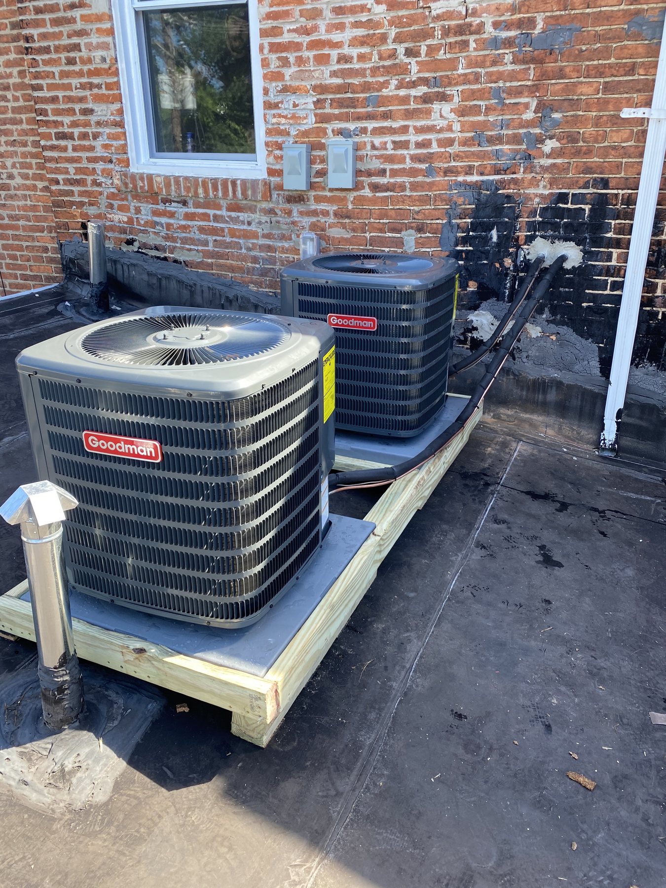 Two Goodman rooftop condenser units